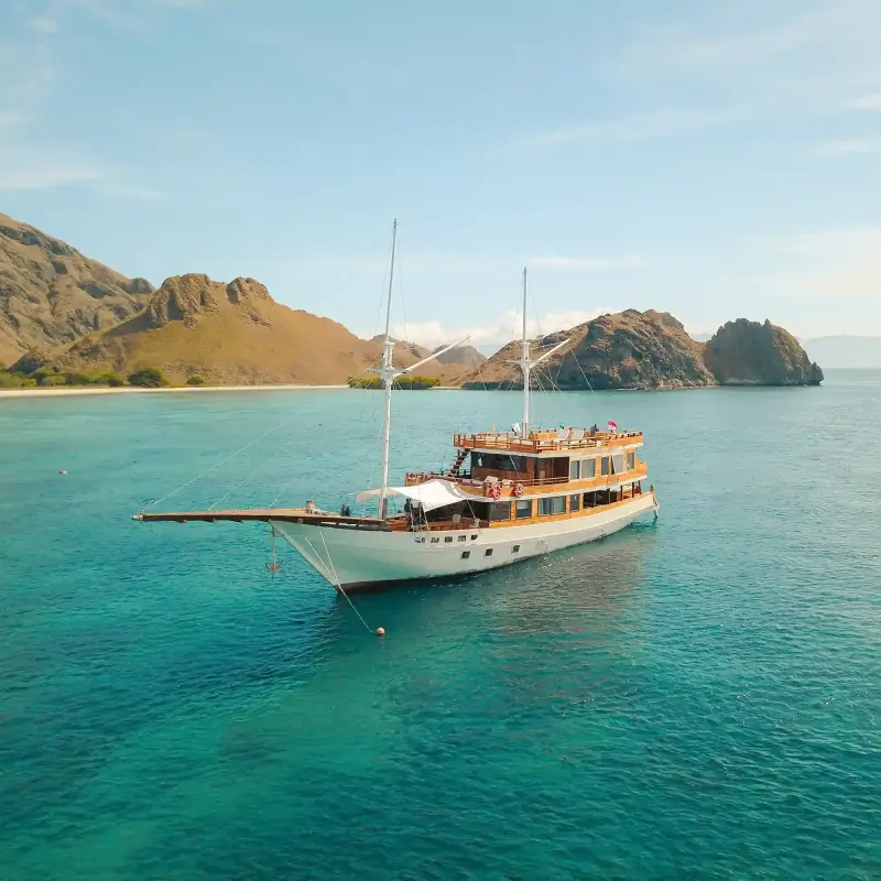 Phinisi anchored in turquoise water
