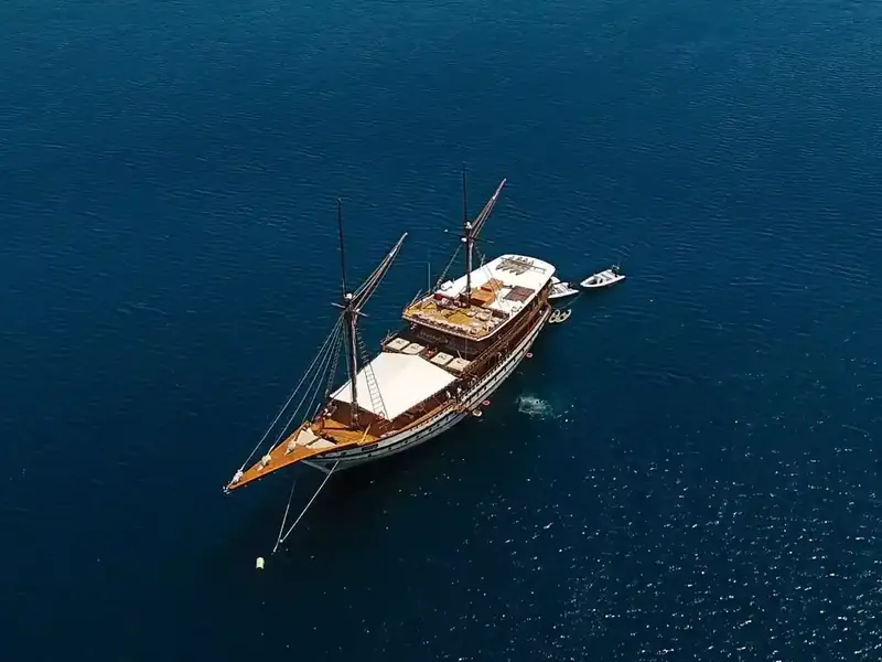 Phinisi hull seen from above on blue water