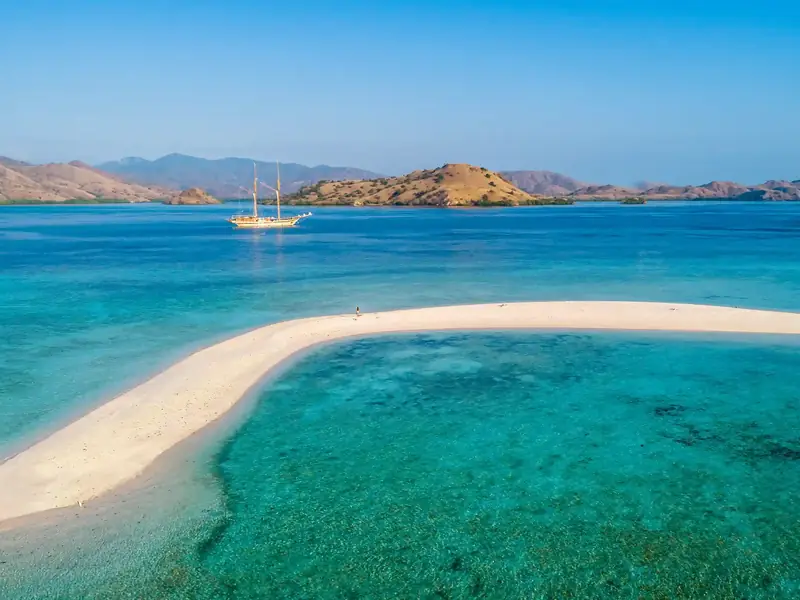 White sandbar in turquoise water in Komodo