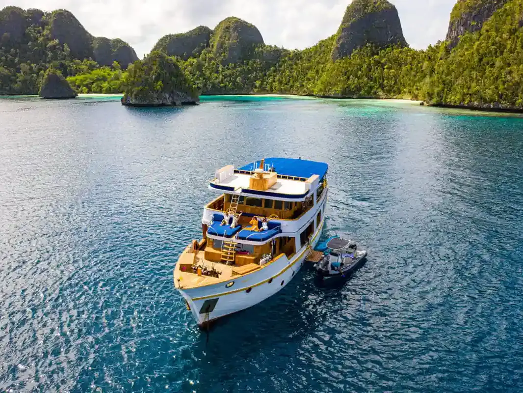 Yacht among the karst islands of Raja Ampat
