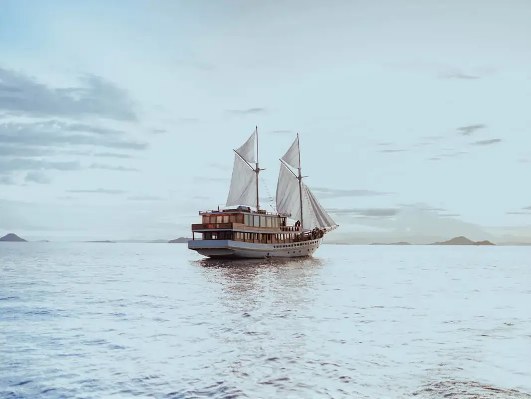 Phinisi sailing in soft light