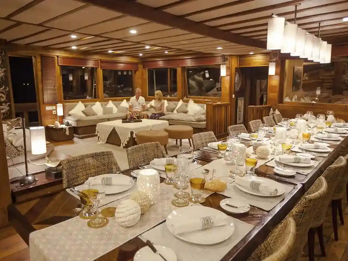 Indoor dining saloon aboard a phinisi