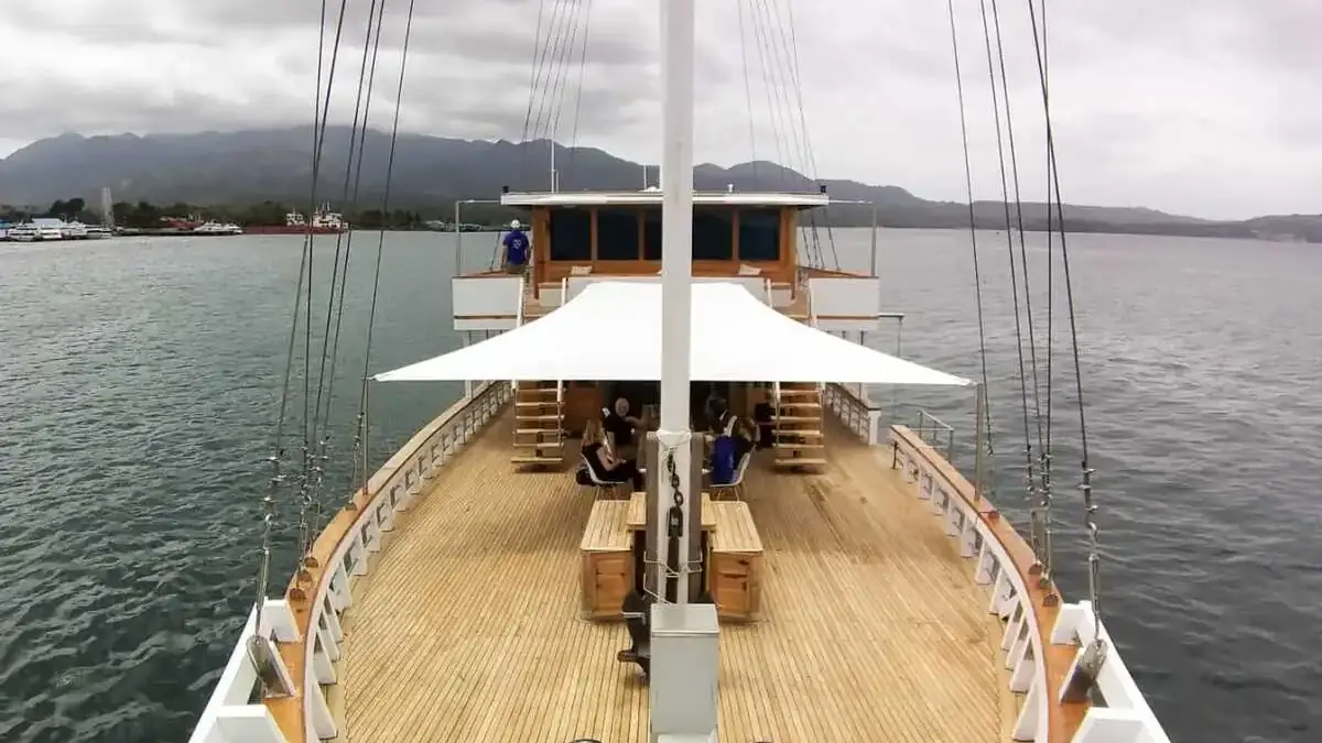 Bow deck of a phinisi under sail, looking forward