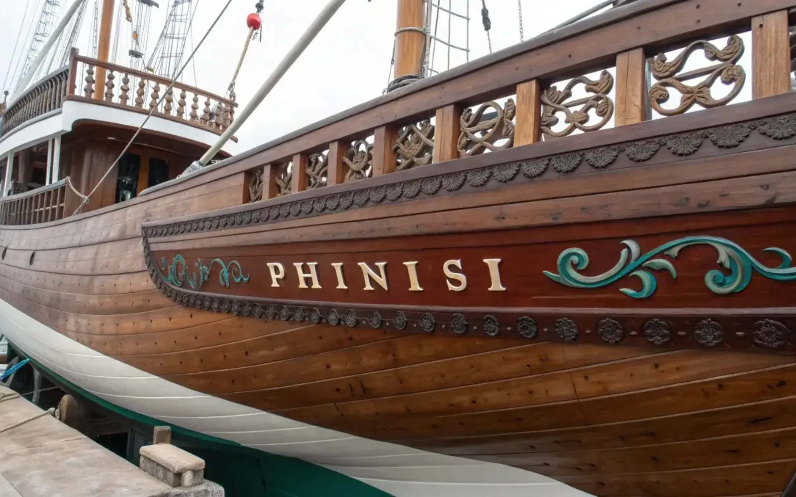 Wooden phinisi hull standing in the yard before launch